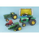 A vintage Tonka XMB 975 tractor together with a John Deere tin plate tractor 8330T,