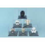 Six Lucas Film Ltd Star Wars helmet collections including Luke Skywalker, C3PO, Storm Trooper,