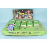A vintage boxed International Subbuteo set, contents disturbed and players missing,