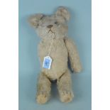A vintage mohair one armed Teddy bear with inner chimes,