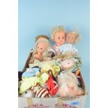 A box of mixed vintage plastic dolls,