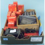 A selection of vintage Triang train accessories including an R52 electric loco, trucks, wagons,