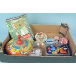 A box of late 50's and early 60's toys including a spinning top,
