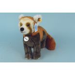 A Steiff collectors red panda,