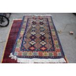 A blue ground multi patterned rug