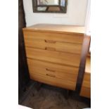 A retro mid 20th Century teak Uniflex chest of six drawers with recessed hidden handles on raised