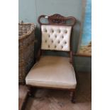 An Edwardian walnut framed lady's easy chair