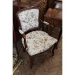 A 20th Century stained beech French style armchair