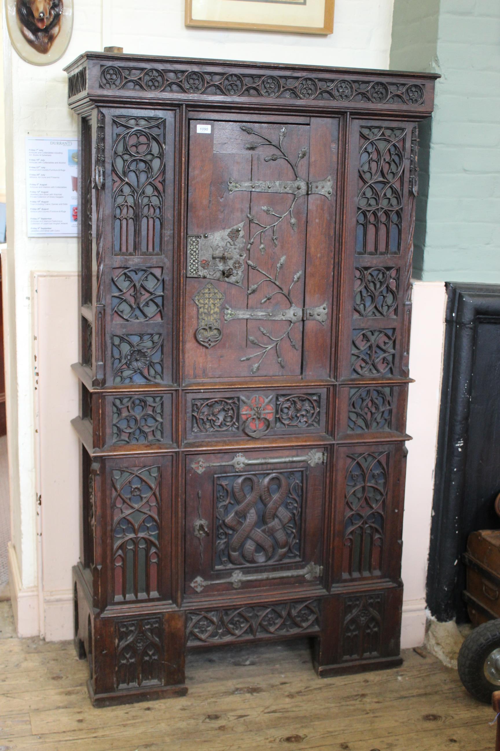 A mid 19th Century oak Gothic Revival cupboard in the manner of A.W.N Pugin.