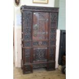 A mid 19th Century oak Gothic Revival cupboard in the manner of A.W.N Pugin.