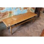 A mid Century teak and beech coffee table with under tier,