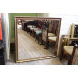A large 20th Century wall mirror in a gilt frame