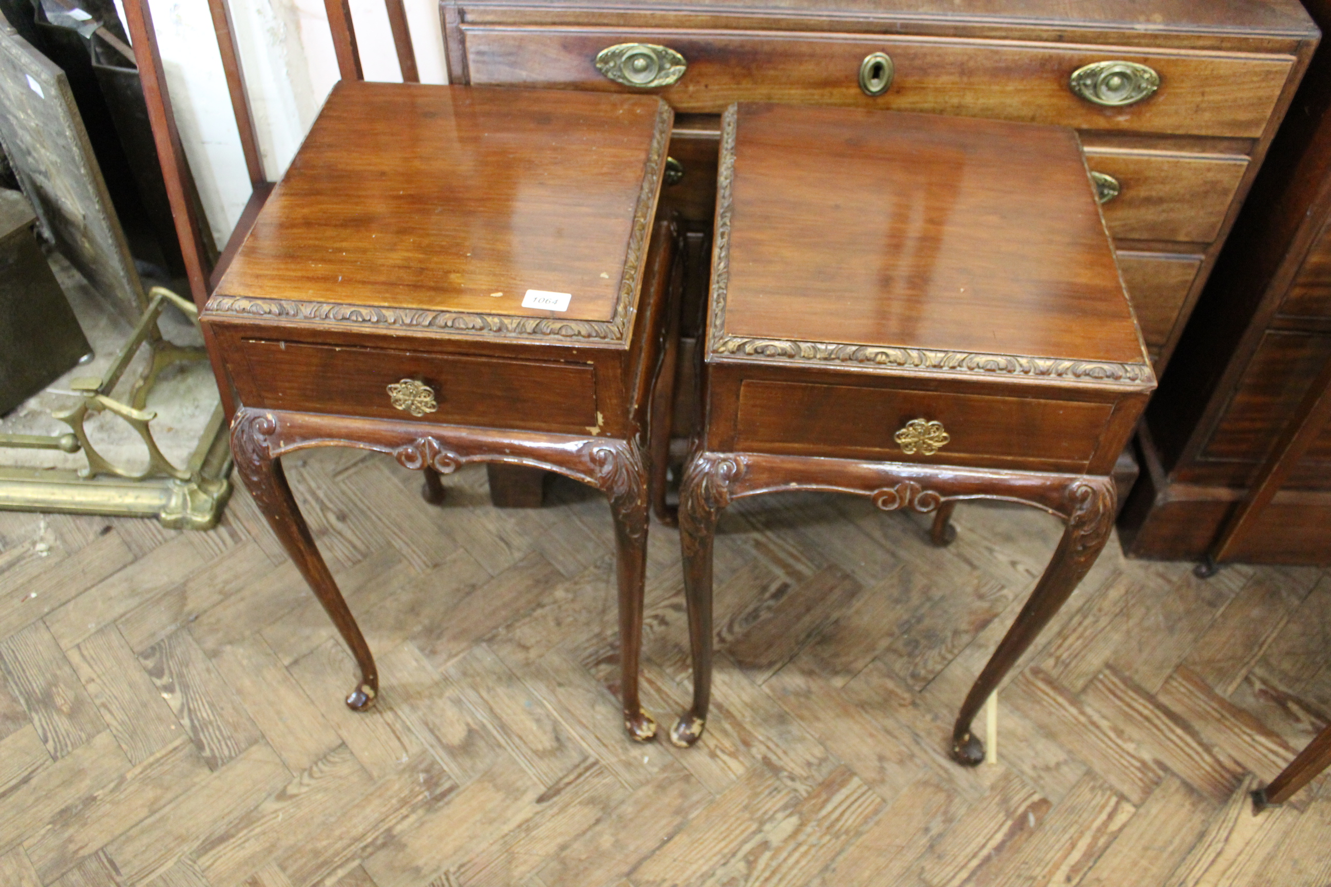 A pair of Queen Anne style stained walnut bedside tables