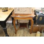 An Edwardian walnut shaped top occasional table