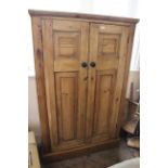 A 19th Century two door cupboard on plinth base