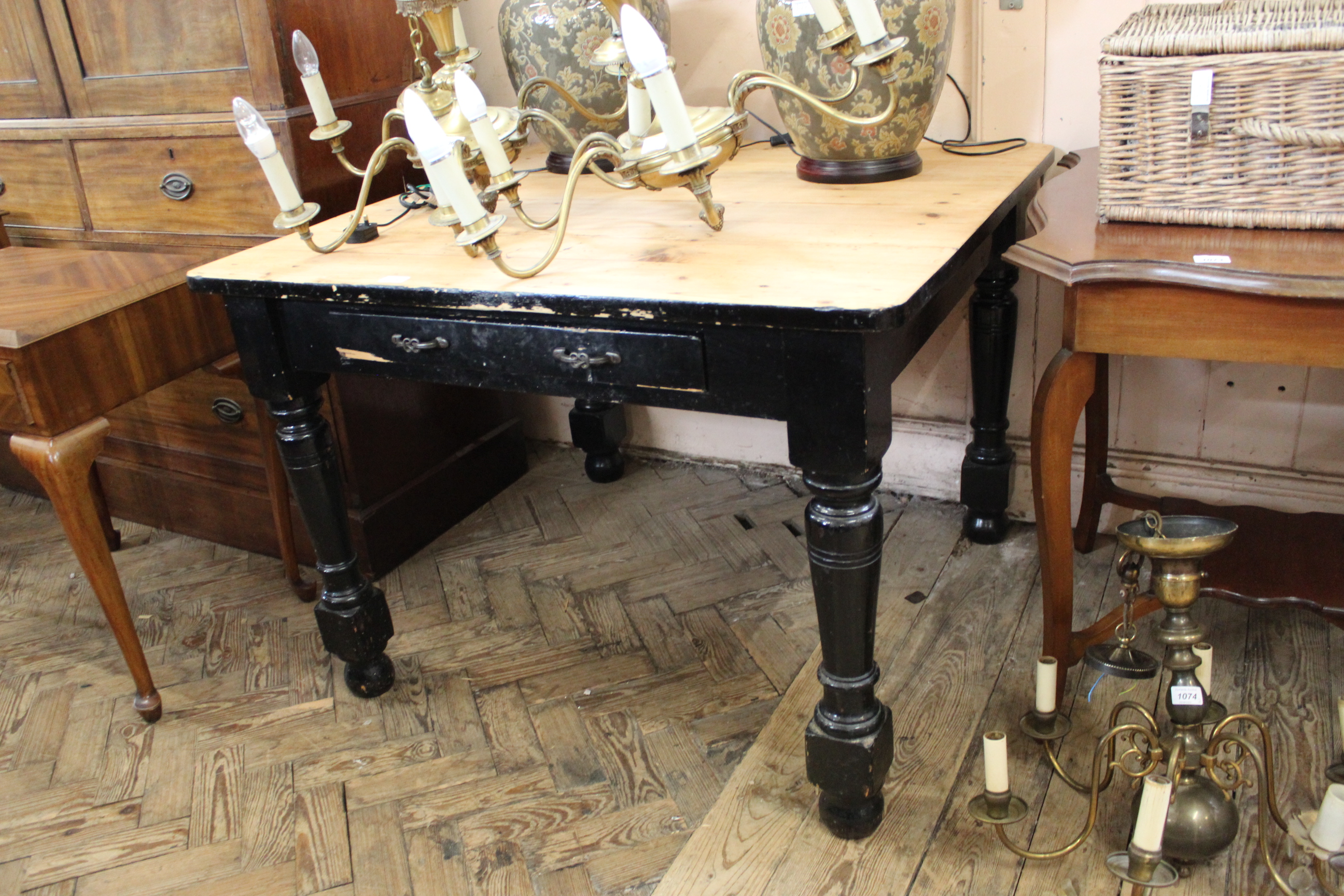 A late 19th Century pine kitchen table with drawer,