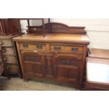 An Edwardian walnut sideboard