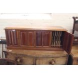 An Edwardian mahogany four door desk top cabinet