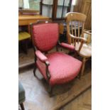 An Edwardian rosewood inlaid open armchair