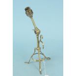 An Arts and Crafts adjustable brass table lamp in the manner of Benson raised on tripod supports,