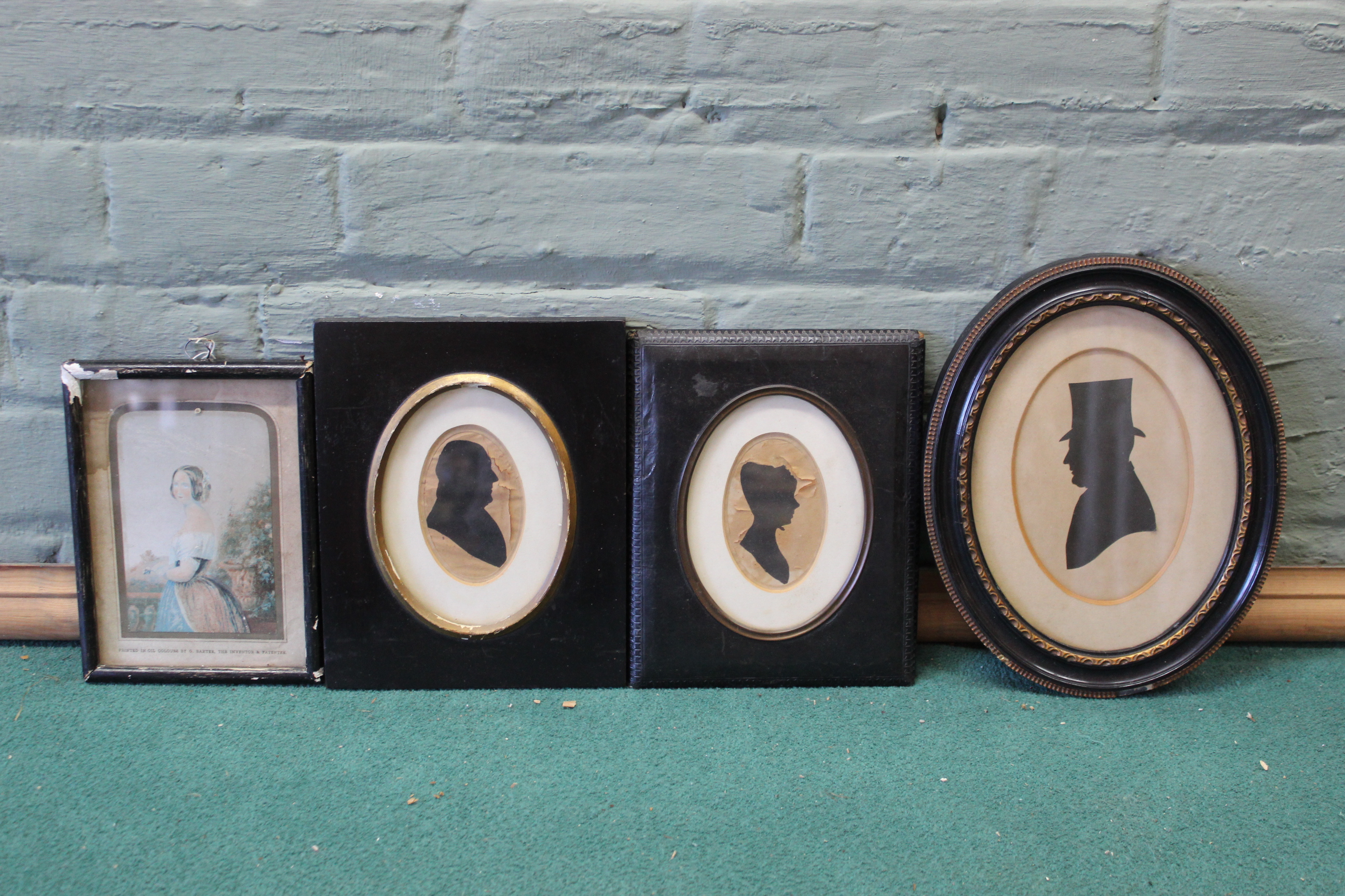 Three silhouettes and a Queen Victoria Baxter print