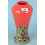An early 20th Century green and red glass art vase