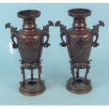 A pair of 19th Century Chinese bronze incense burners with relief floral and bird decoration with