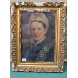 A 19th Century oil on canvas portrait of a woman wearing a brooch,