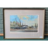 A framed watercolour and ink painting of Thames Barges lying at Pin Mill by Michael Norman 1996,