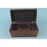 A mid 19th Century rosewood sarcophagus shaped tea caddy