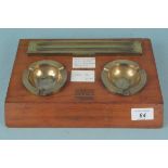 A Great Western Railway Bristol solid wood and bronze pen stand with ashtrays,