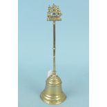 Nelson interest, an early 20th Century brass doorstop with half bell shaped weighted base,