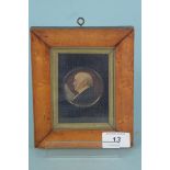 A mid 19th Century miniature watercolour portrait on card in the original maple frame inscribed on