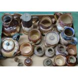A quantity of assorted Doulton stoneware jugs, tobacco jars,