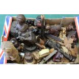 A box of assorted carved wooden figures and animals,