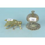 An early 20th Century brass shop counter bell on ornate base plus a brass table vesta in the form