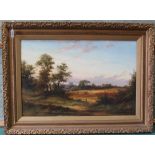A large oil on canvas of a summers evening with a view of fields, people and a distant church,
