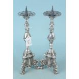 An ornate pair of silver plated pricket candlesticks,