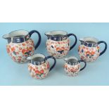 A set of five graduating Ironstone jugs with Imari palette