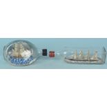 Two fully rigged ships in bottles