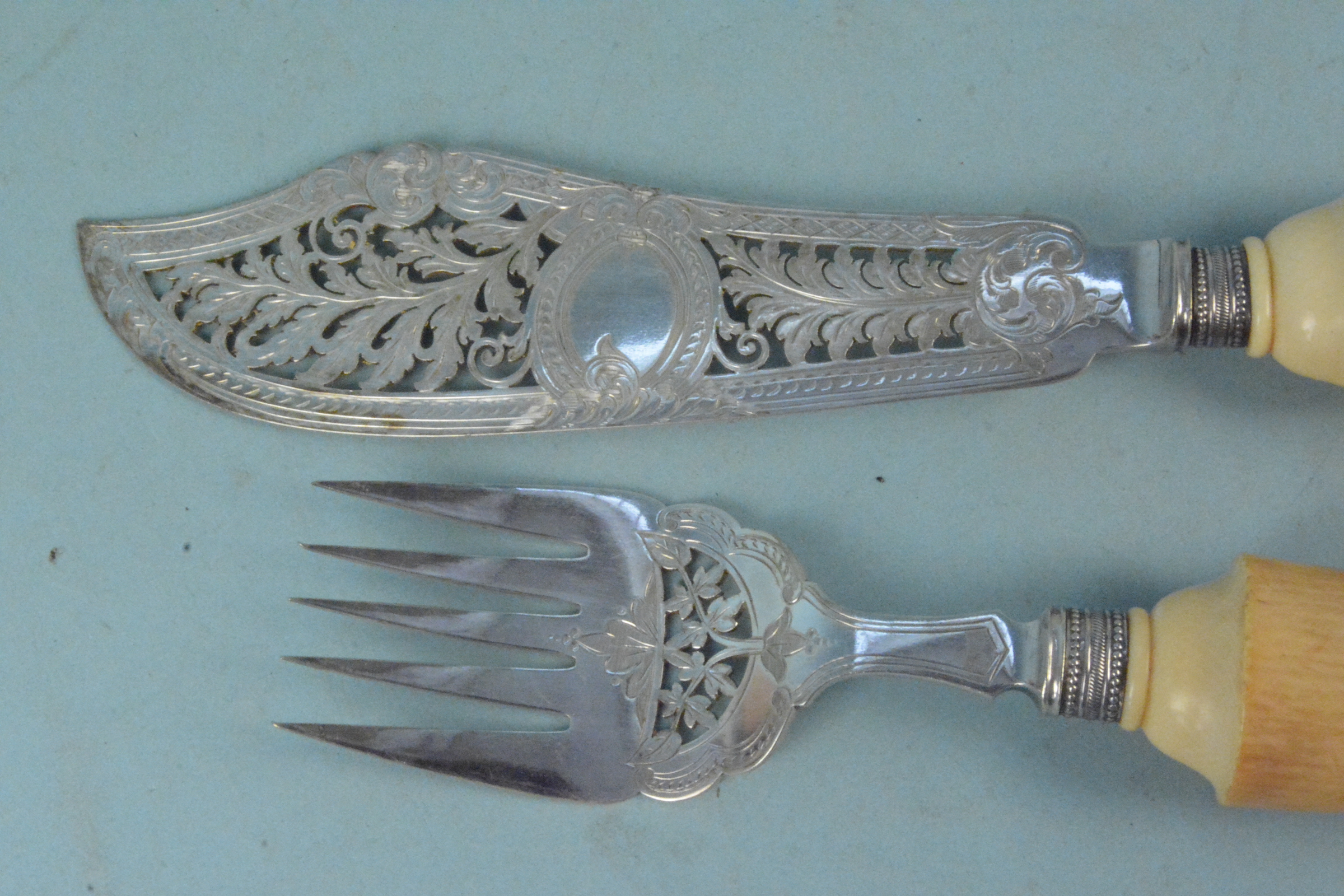 A late 19th Century boxed pair of fish servers with pierced silver plate blades and ivorine handles - Image 2 of 3