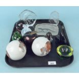 A tray of mixed glass animal paperweights etc together with a pair of ceramic balls decorated with