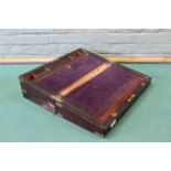 A mid 19th Century rosewood brass bound writing box with fitted interior and secret drawers