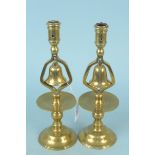 A pair of heavy 19th Century brass tavern candlesticks with central column bells,