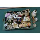 A mixed box of ceramics including figurines, jugs,