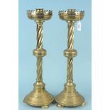 A large pair of 19th Century brass church candlesticks with pierced gallery tops,
