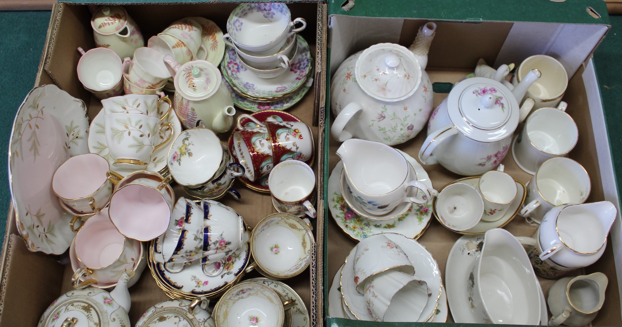Two boxes of assorted part tea services including Royal Albert,
