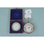 An early 20th Century cased GPO compensated barometer plus a large Goliath style pocket barometer