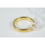 A 22ct gold wedding band, size M,