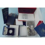 A stacker box containing mixed British and world coins including some silver,